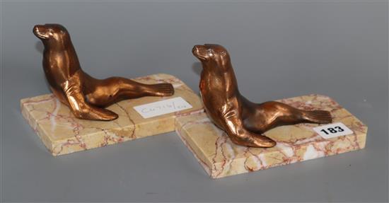 A pair of French Art Deco marble base seal book ends